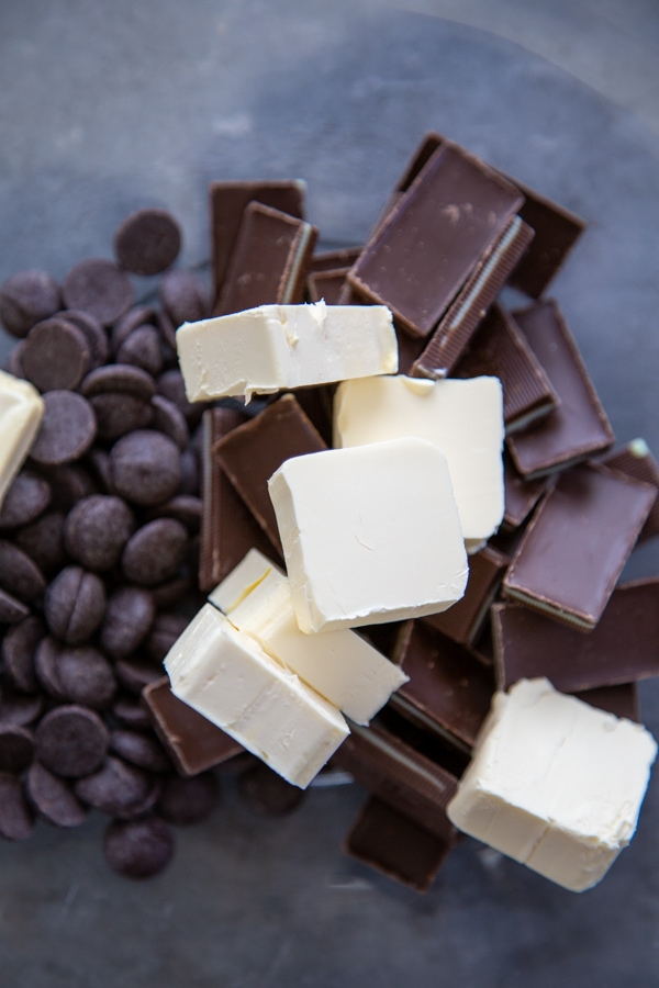 chocolate chips, margarine, and mint chocolate candies in a bowl.