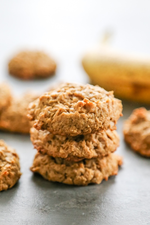 Chewy HEALTHY PEANUT BUTTER BANANA COOKIES are a twist on your peanut butter cookie recipe. Made with no butter and less sugar, they make a great snack! a stack of three cookies.