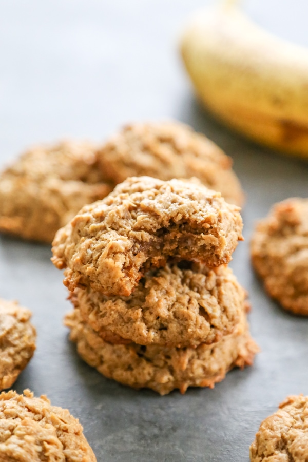 Chewy HEALTHY PEANUT BUTTER BANANA COOKIES are a twist on your peanut butter cookie recipe. Made with no butter and less sugar, they make a great snack! a stack of three cookies.