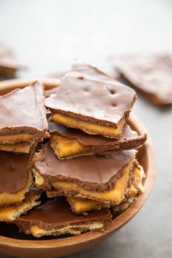 Peanut Butter Toffee Bark stacked on a plate.