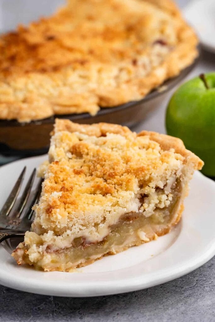 slice of apple pie with crumb topping