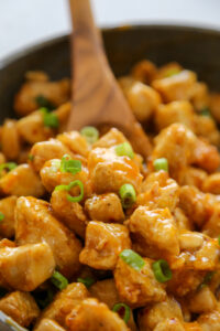 the chicken coated in the sauce.
