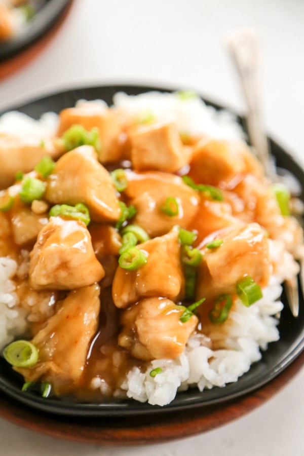 close-up shot of a plate of sweet and sour chicken.