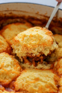 biscuit in chili in baking pan