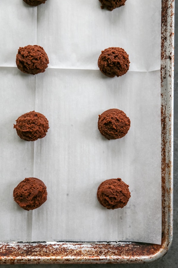 overhead shot of the cookie dough balls on the prepared baking sheet.