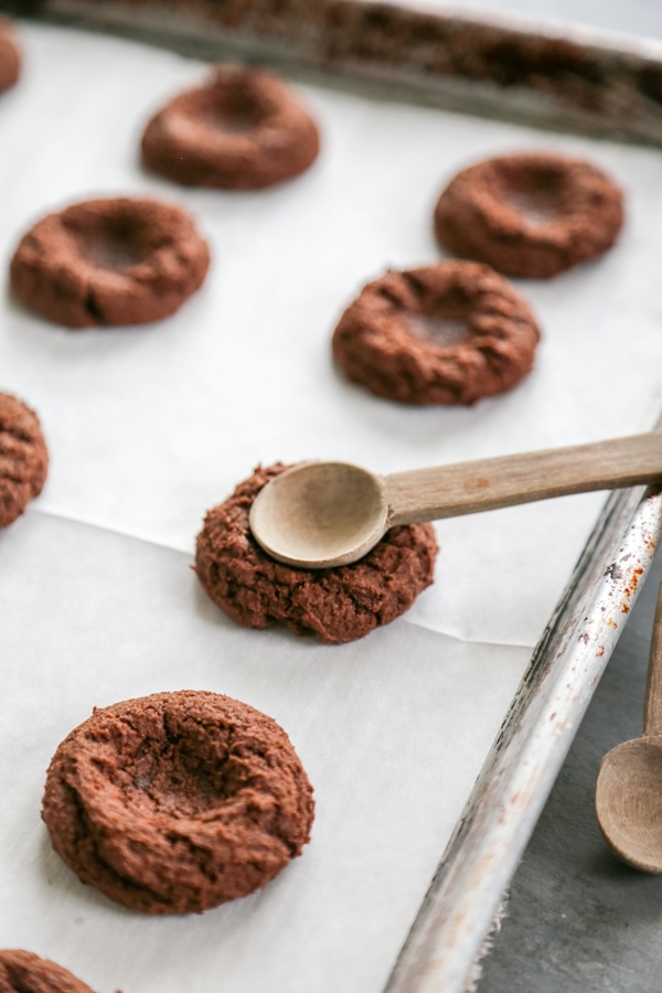 the thumprint being pressed into the cookies.