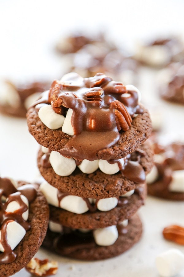 These Mississippi Mud Cookies are rich, gooey chocolate pecan cookies that are an insanely delicious twist of the classic pie. a stack of four cookies.