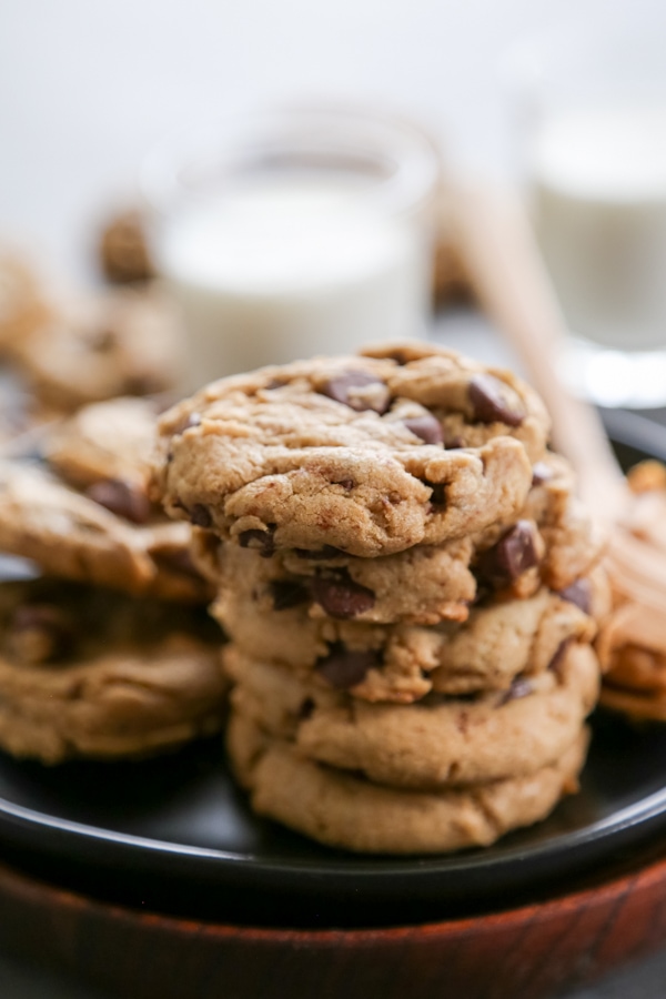 a stack of soft peanut butter cookies on a plate.