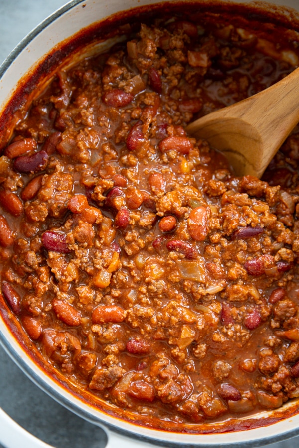 overhead shot of a pot of beef and bean chili.