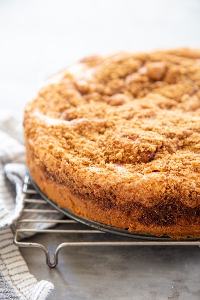a coffee cake cooling on a wire rack.