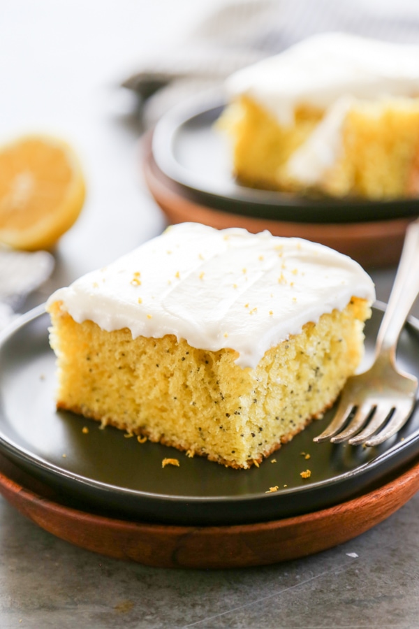 a slice of lemon poppyseed cake on a plate.