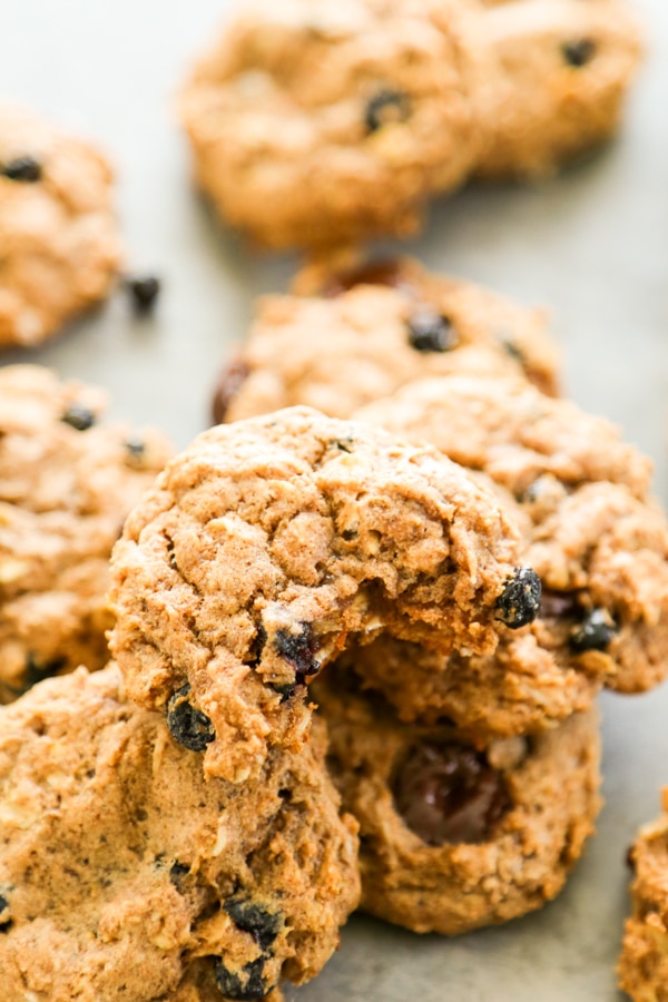 close up shot of a pile of oatmeal cookies.