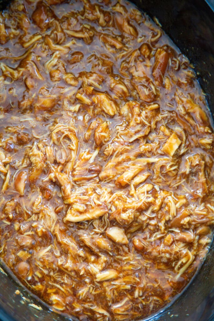 shredded chicken teriyaki in a crock pot.