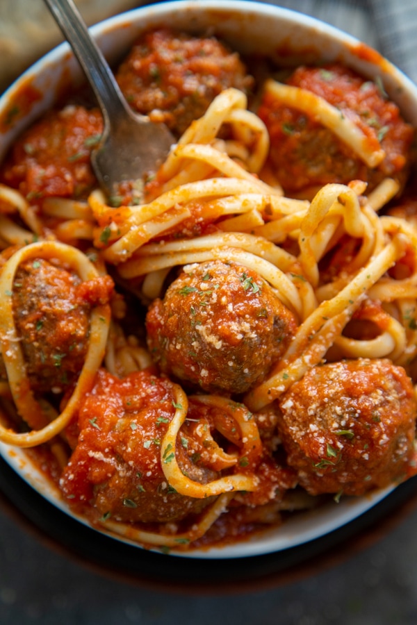 a bowl of spaghetti and meatballs.
