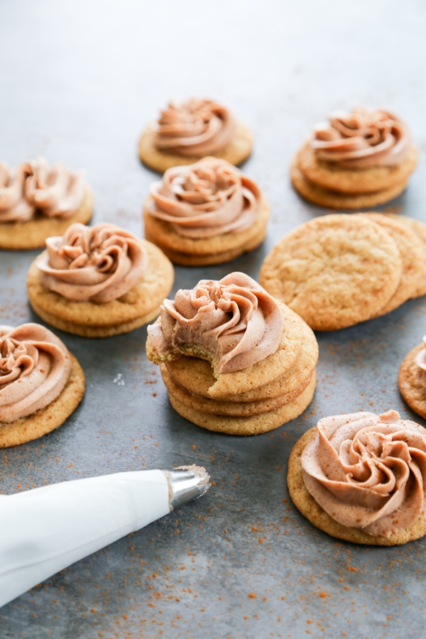 stacks of cookies with frosting on top.