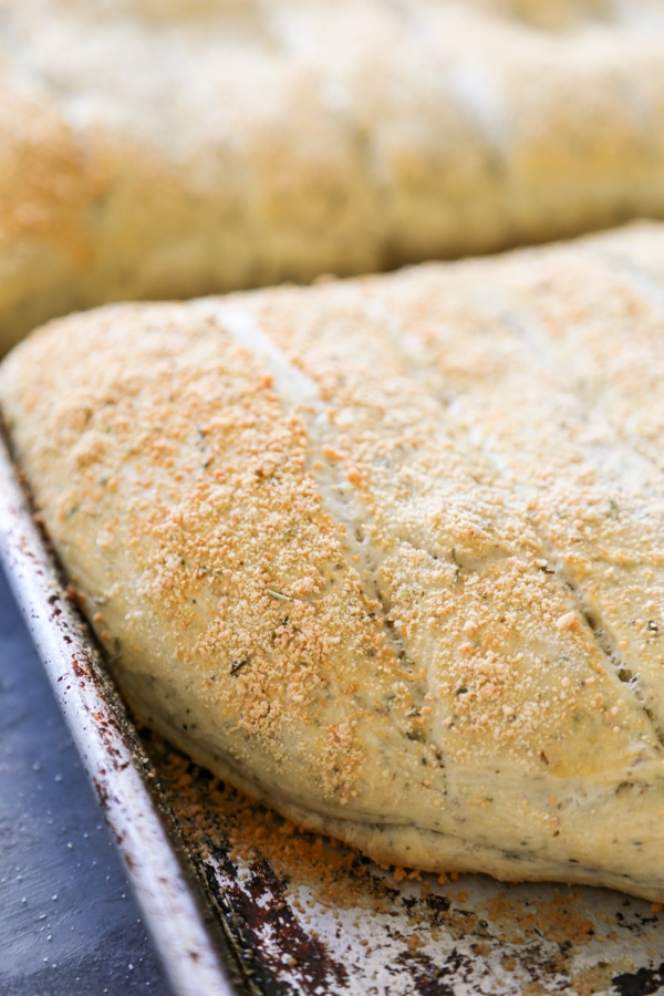 baked focaccia breadsticks on a baking pan.