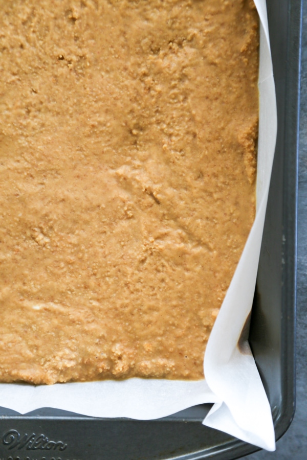 the peanut butter layer pressed into the pan.