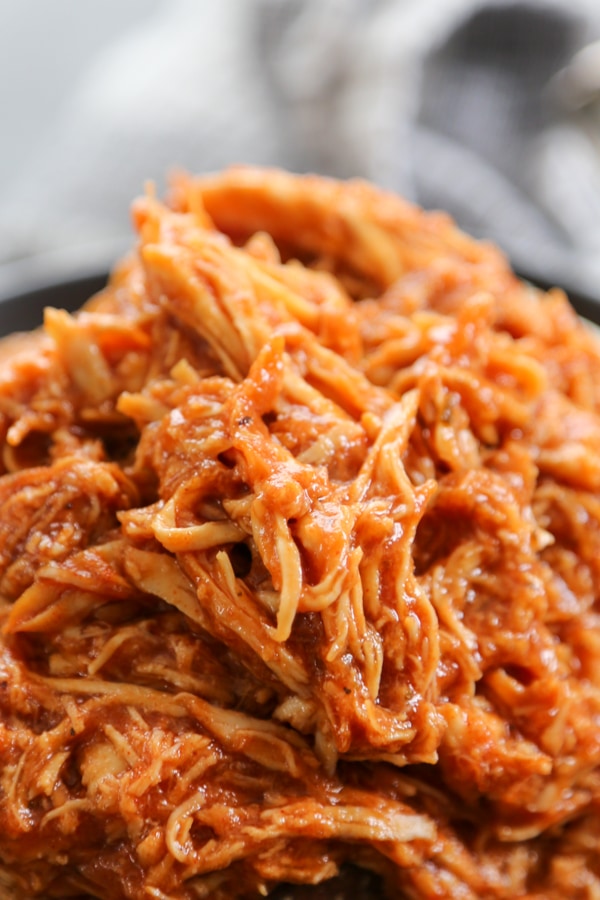 This Slow Cooker Chipotle Barbecue Chicken is a family favorite. The smoky heat from the chipotle and the sweetness from the BBQ sauce makes a great combo close up shot of the shredded chicken.