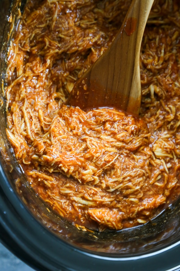 shredded BBQ chicken in a slow cooker.