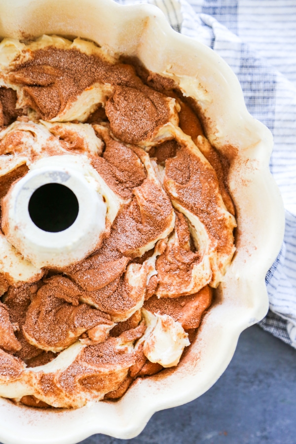 overhead shot swirled cake batter in bundt cake pan