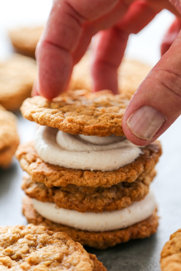 a sandwich cookie being assembled.