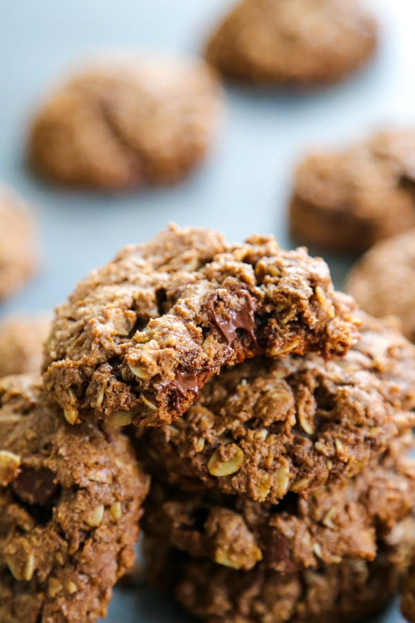chocolate monster cookies with Reese's with bite out of the cookie