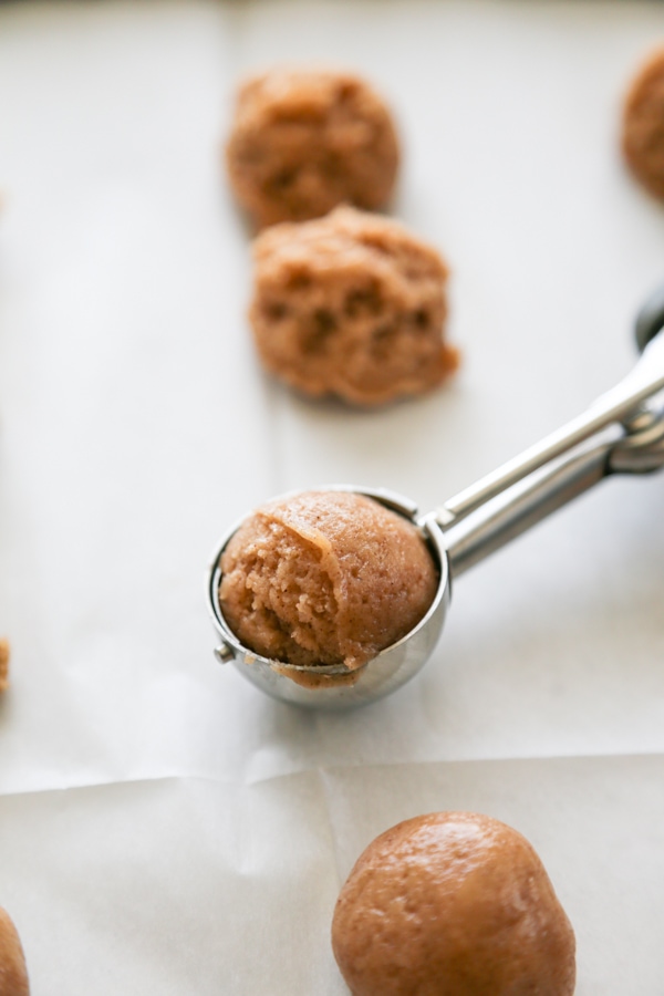 the dough being scooped into balls.