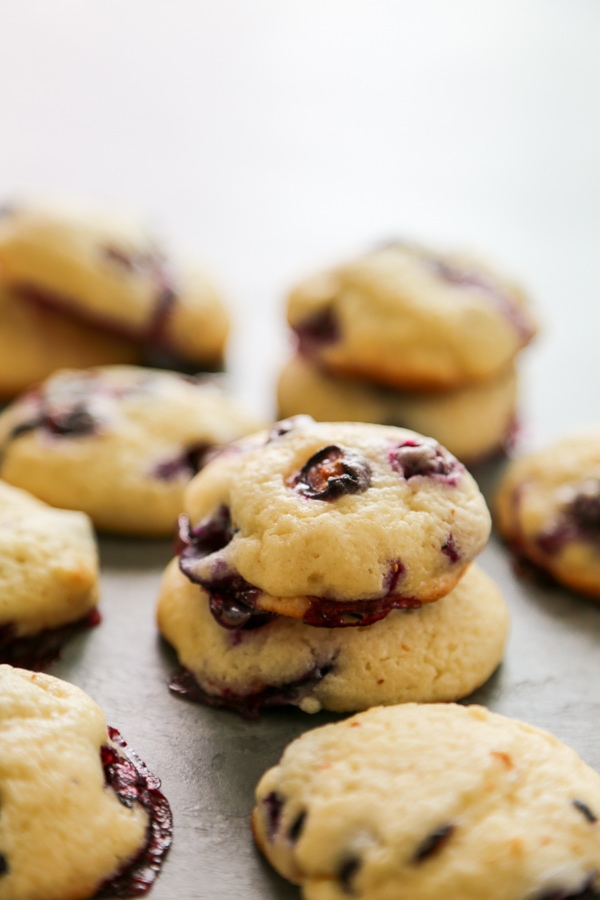 two cookies stacked on top of each other with other cookies around them.
