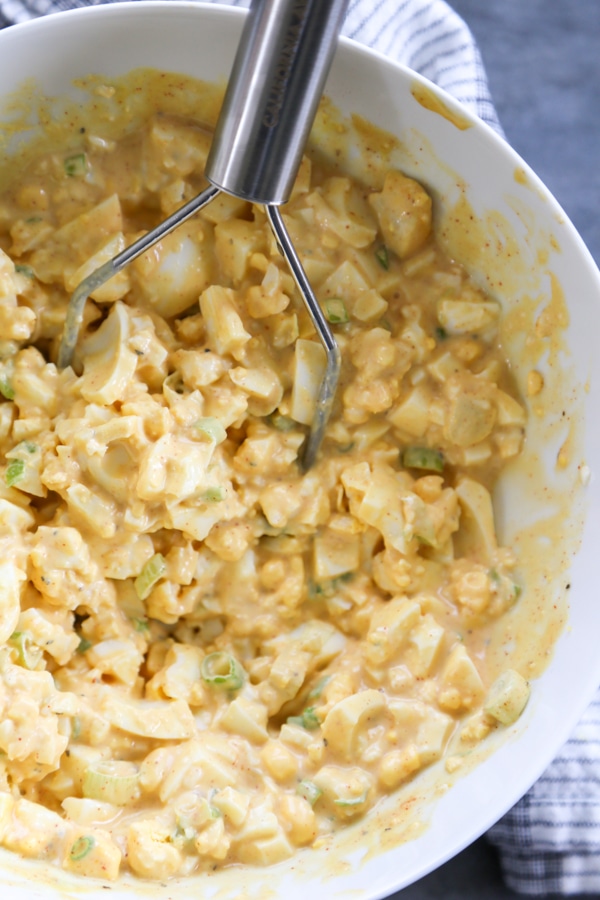 the egg salad mixed in a bowl.