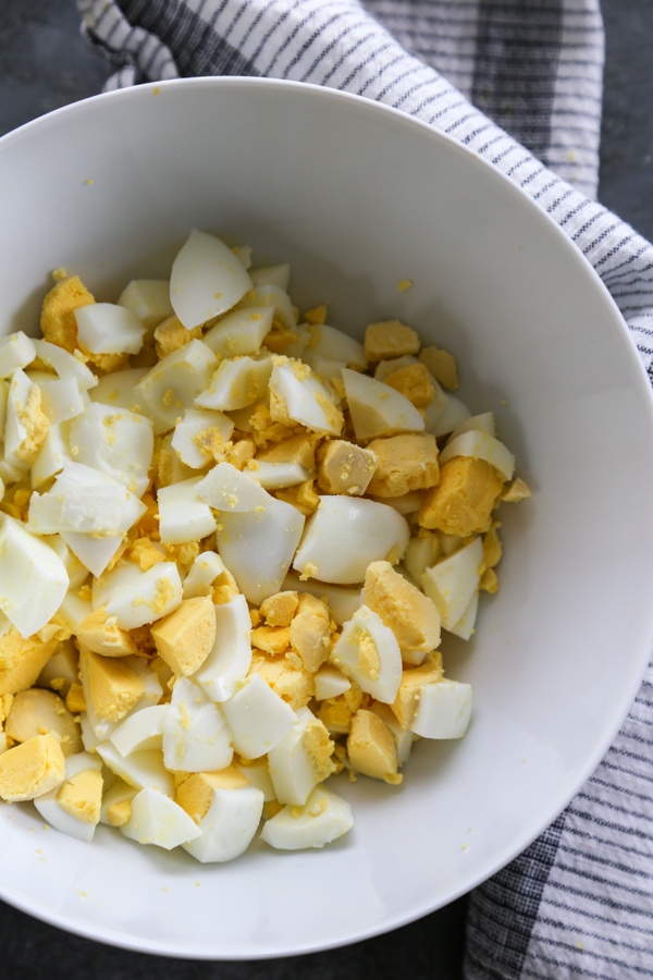 overhead shot of the chopped eggs in a bowl.