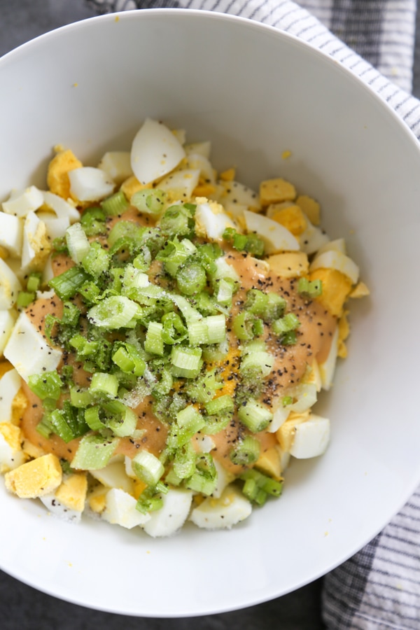 celery and green onions added to the bowl.
