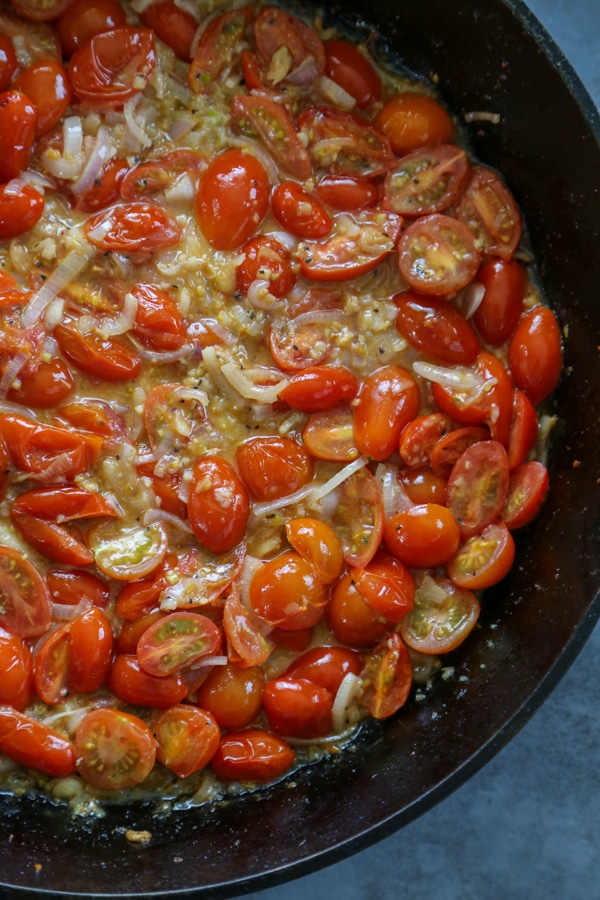 the cooked tomatoes in the skillet.