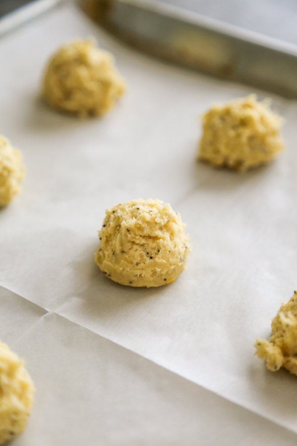 the cookie dough balls on a baking sheet lined with parchment paper.