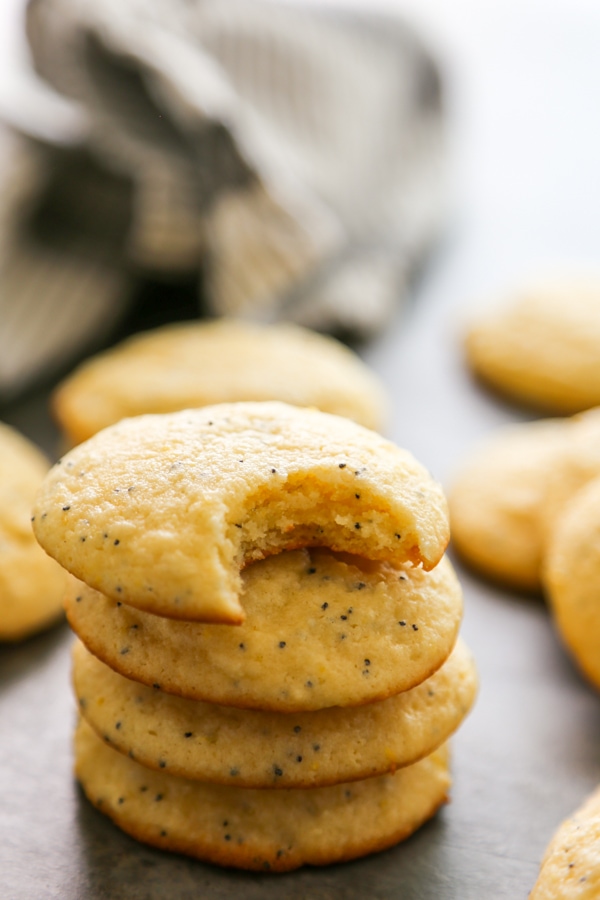 a stack of cookies with a bite taken out of the top one.