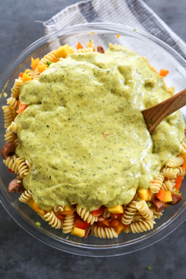 Mango Pasta Salad is a sweet and mildly spicy pasta salad made with fresh mangoes, peppers, sausage, and drizzled with a citrus vinaigrette. the dressing added to the mango pasta salad