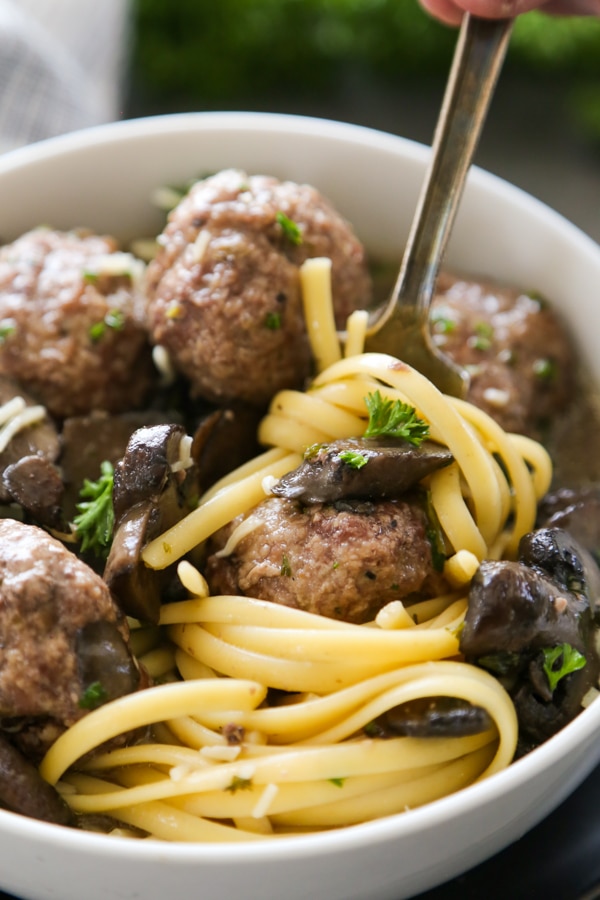 close-up shot of meatballs and pasta in a bowl.
