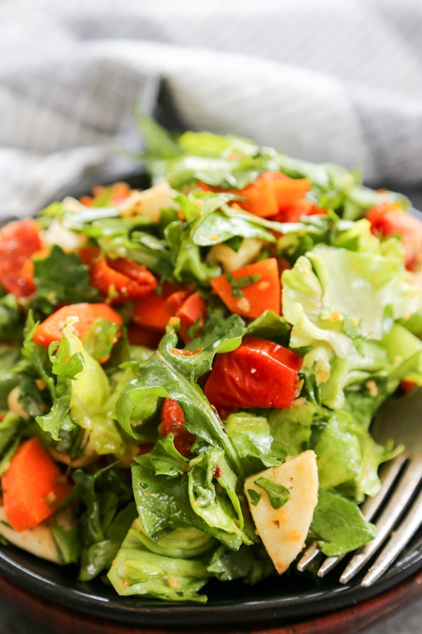 close up shot of kale salad on a plate.