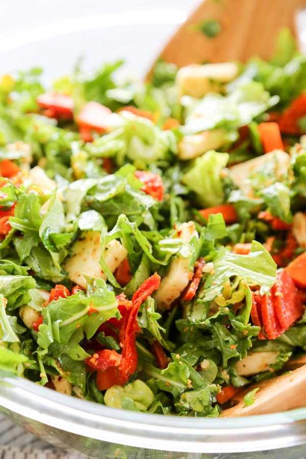 close up shot of Italian kale salad in a serving bowl.