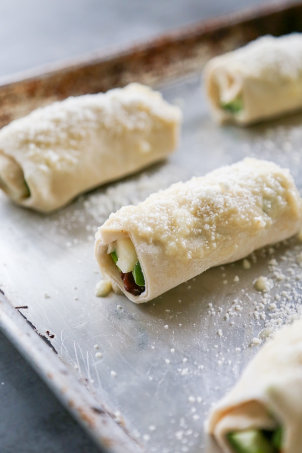 the raw breadsticks topped with parmesan cheese.