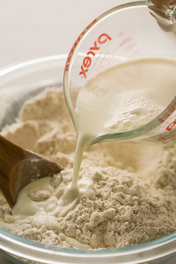 milk being poured into the bowl.