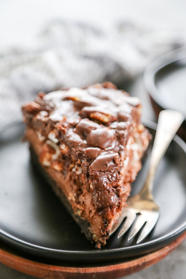a slice of Mississippi Mud Pie cheesecake on a plate.