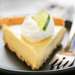 a slice of key lime pie on a plate.