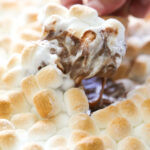 the dip being scooped with a graham cracker.