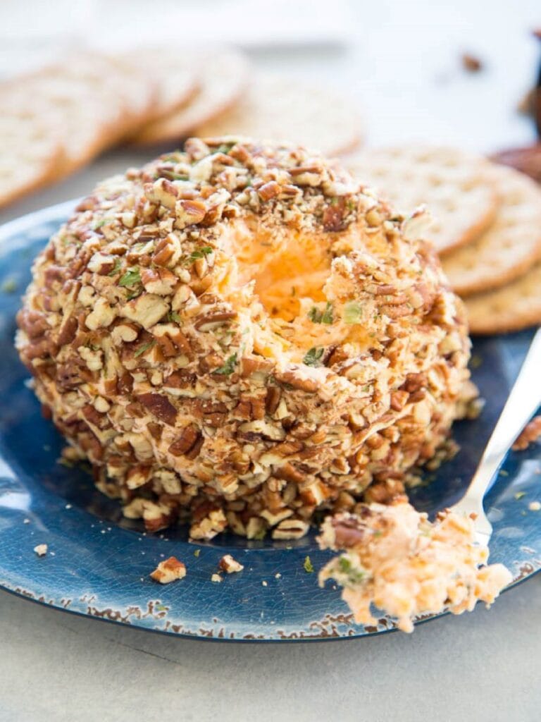 cheese ball on plate with crackers