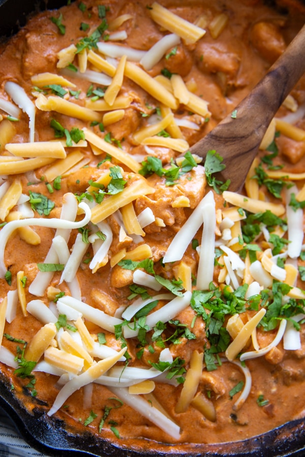 cream cheese salsa chicken skillet recipe topped with cheese and cilantro