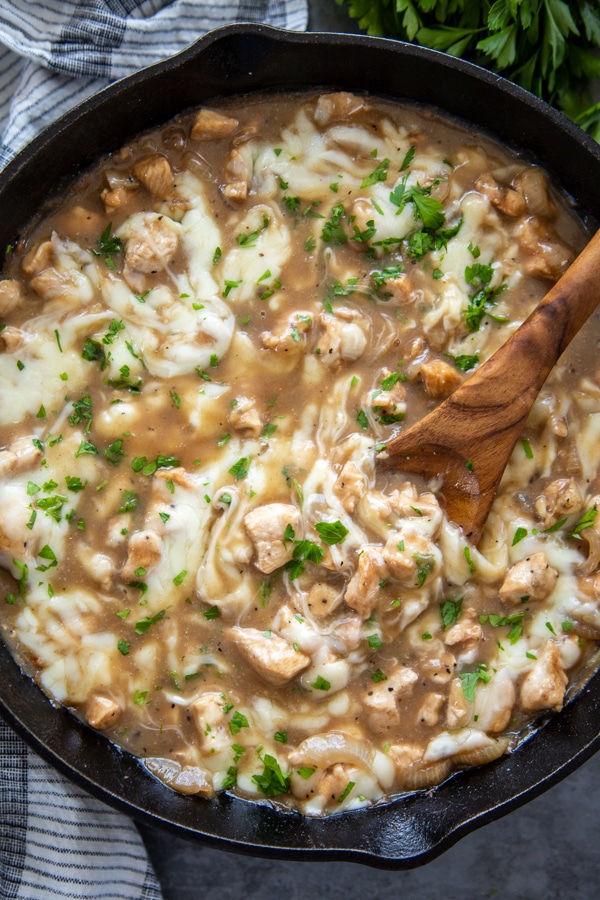 overhead shot of skillet with chicken, cheese and french onion soup