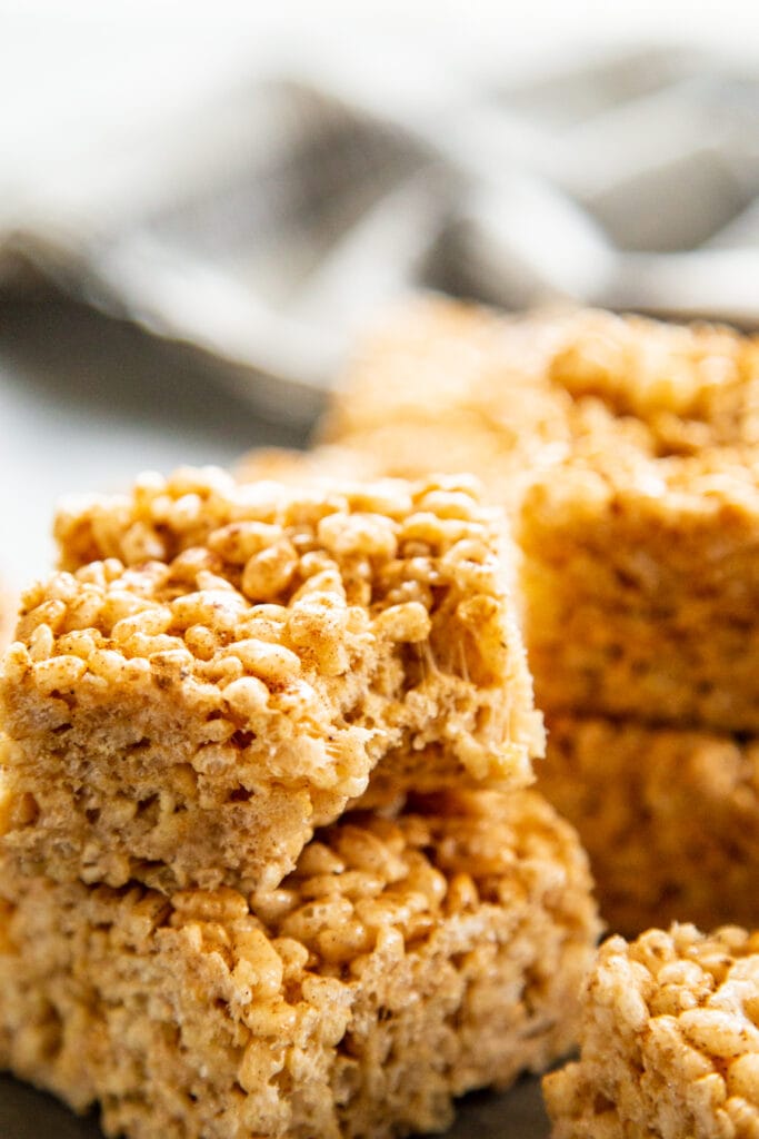 stack of pumpkin spice rice krispie treats with bite taken out