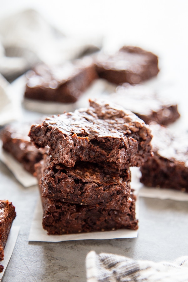 stack of brownies with a bite taken out of the top one