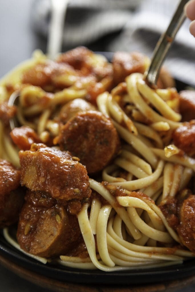 italian sausage sausage with noodles on plate
