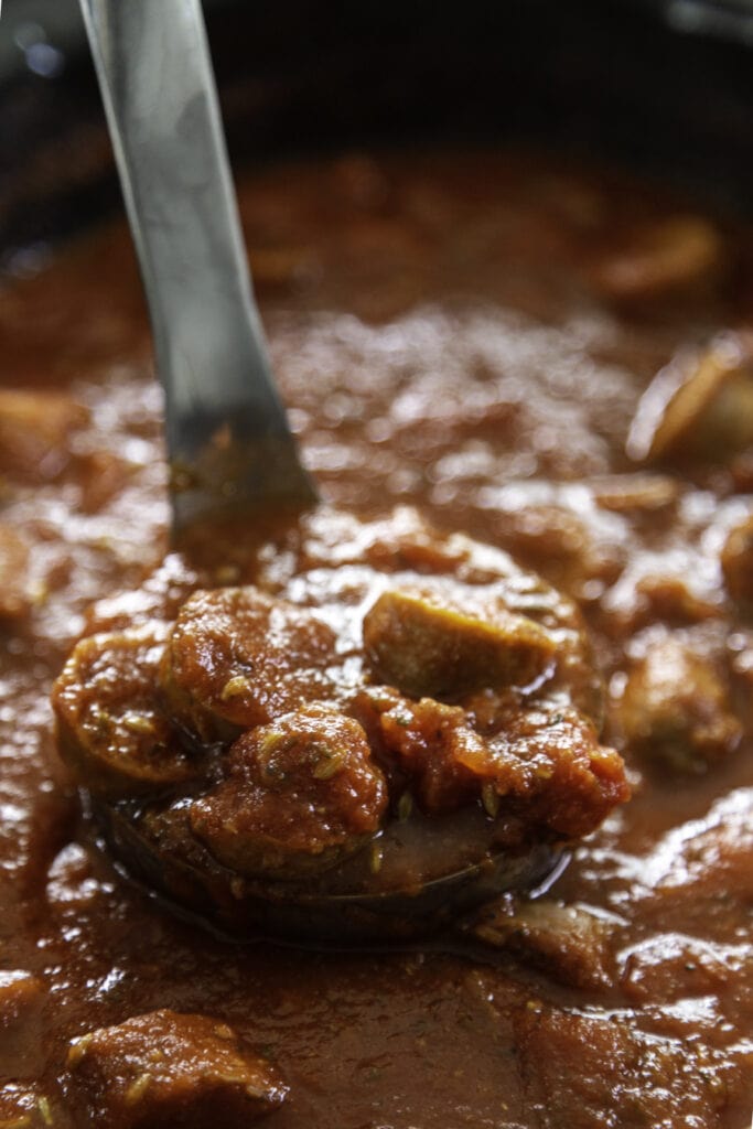 ladle of italian sausage sauce